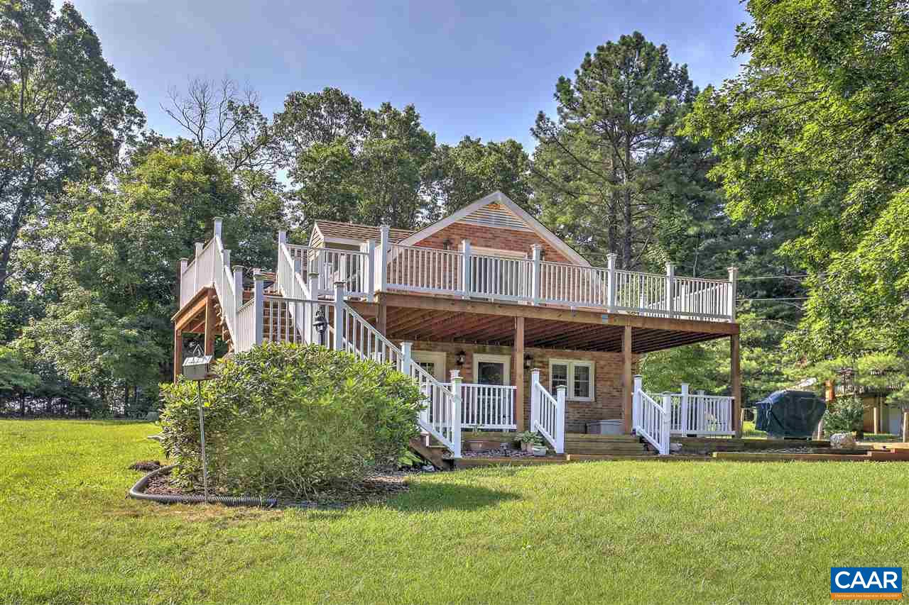 64 Horseshoe Hill Road Ruckersville, VA 22968 - Photo 1 of 33 a front view of a house with a garden