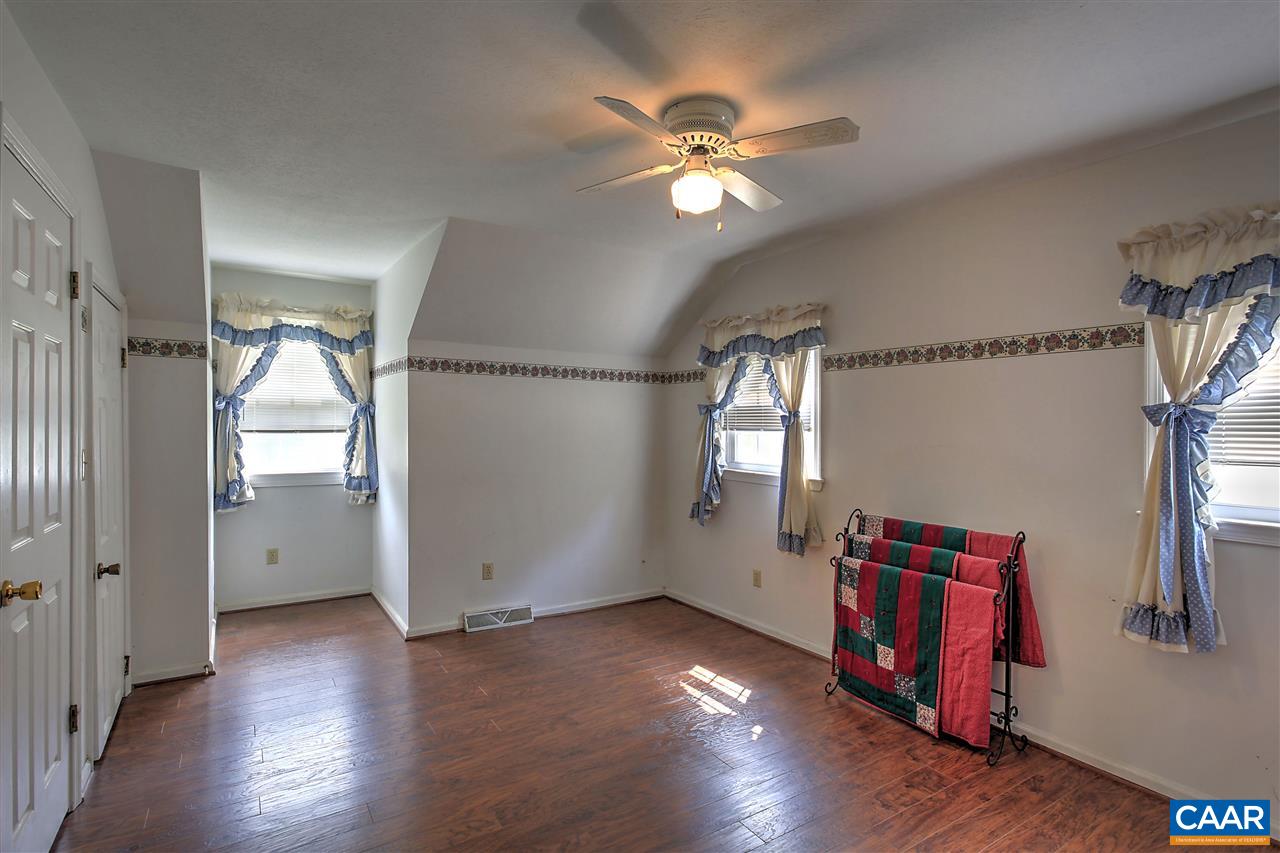 64 Horseshoe Hill Road Ruckersville, VA 22968 - Photo 14 of 33 an empty room with wooden floor and windows