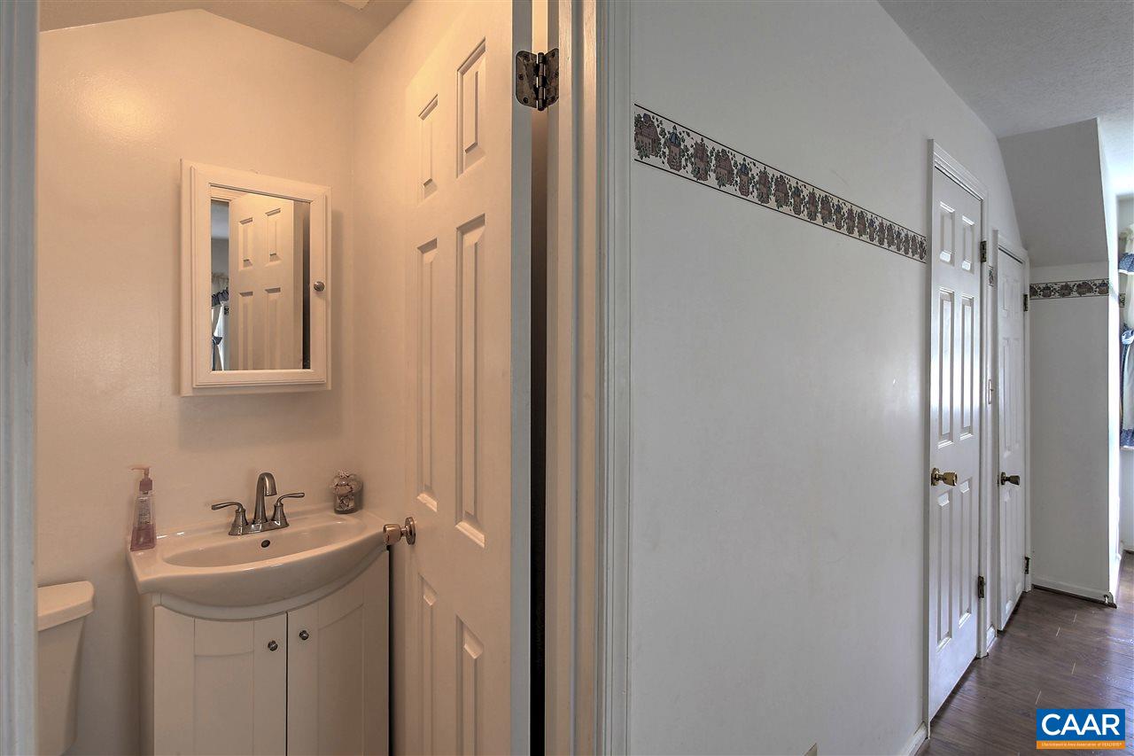 64 Horseshoe Hill Road Ruckersville, VA 22968 - Photo 15 of 33 a bathroom with a sink mirror and shower