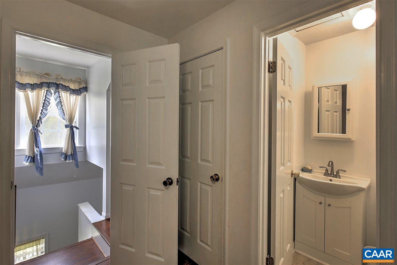 64 Horseshoe Hill Road Ruckersville, VA 22968 - Photo 17 of 33 a bathroom with a granite countertop sink and a mirror