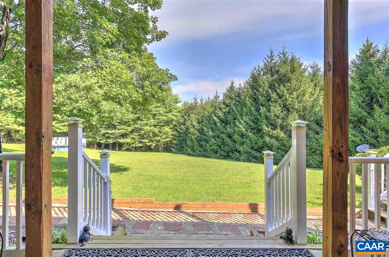 64 Horseshoe Hill Road Ruckersville, VA 22968 - Photo 2 of 33 a view of a back yard from a balcony