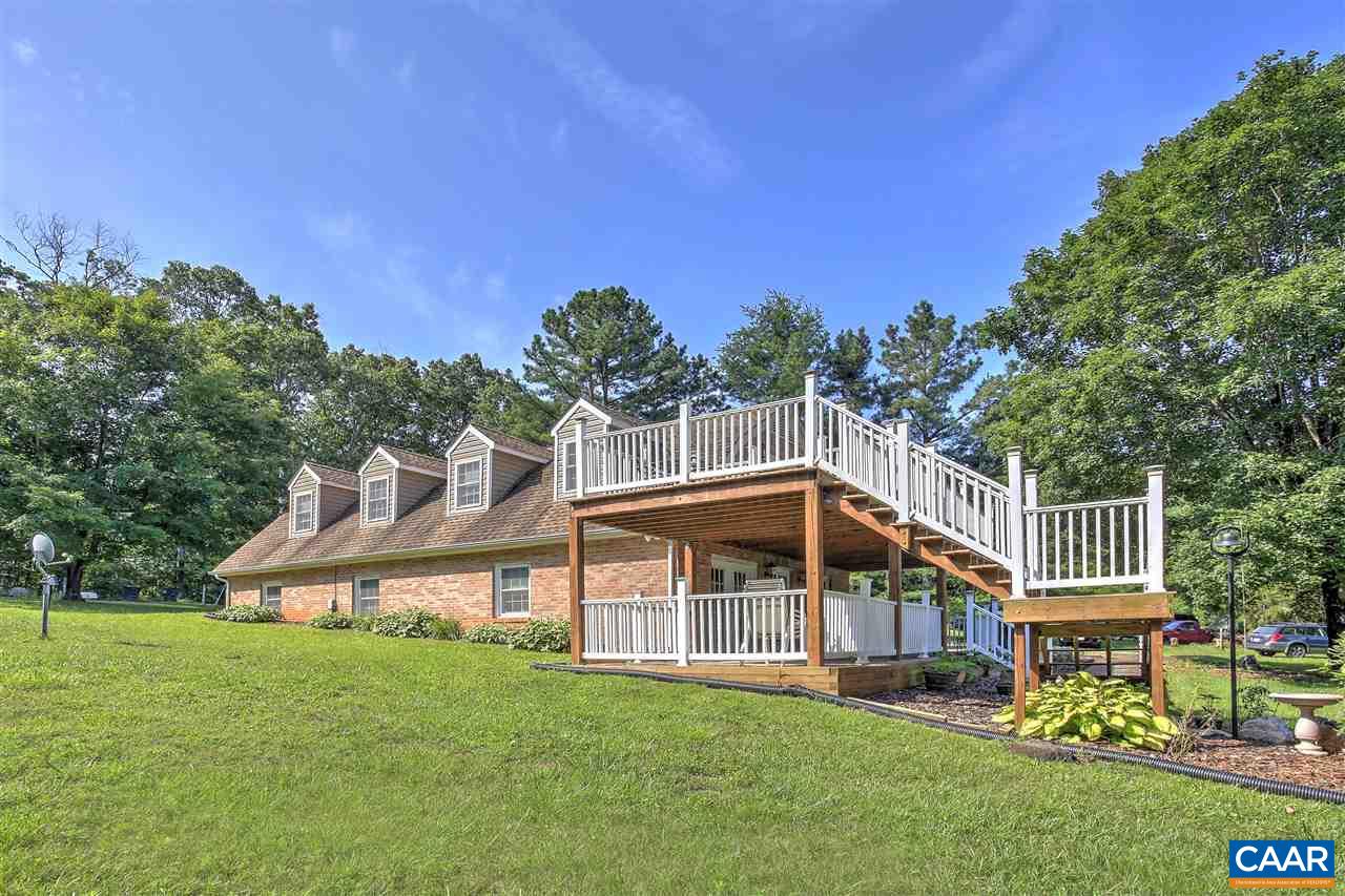 64 Horseshoe Hill Road Ruckersville, VA 22968 - Photo 24 of 33 a view of a house with a big yard and large trees