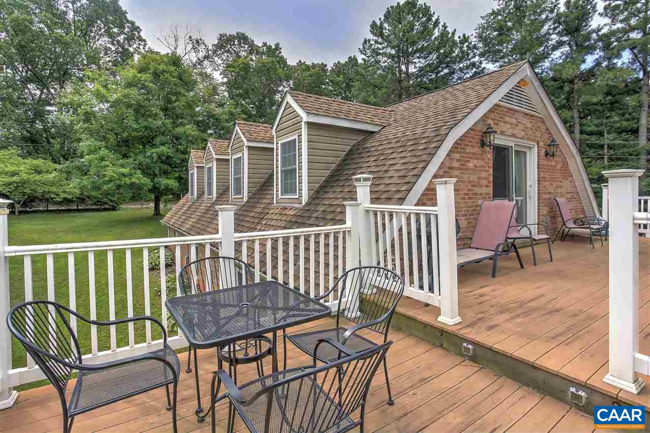 64 Horseshoe Hill Road Ruckersville, VA 22968 - Photo 25 of 33 a view of a chair and table on the deck