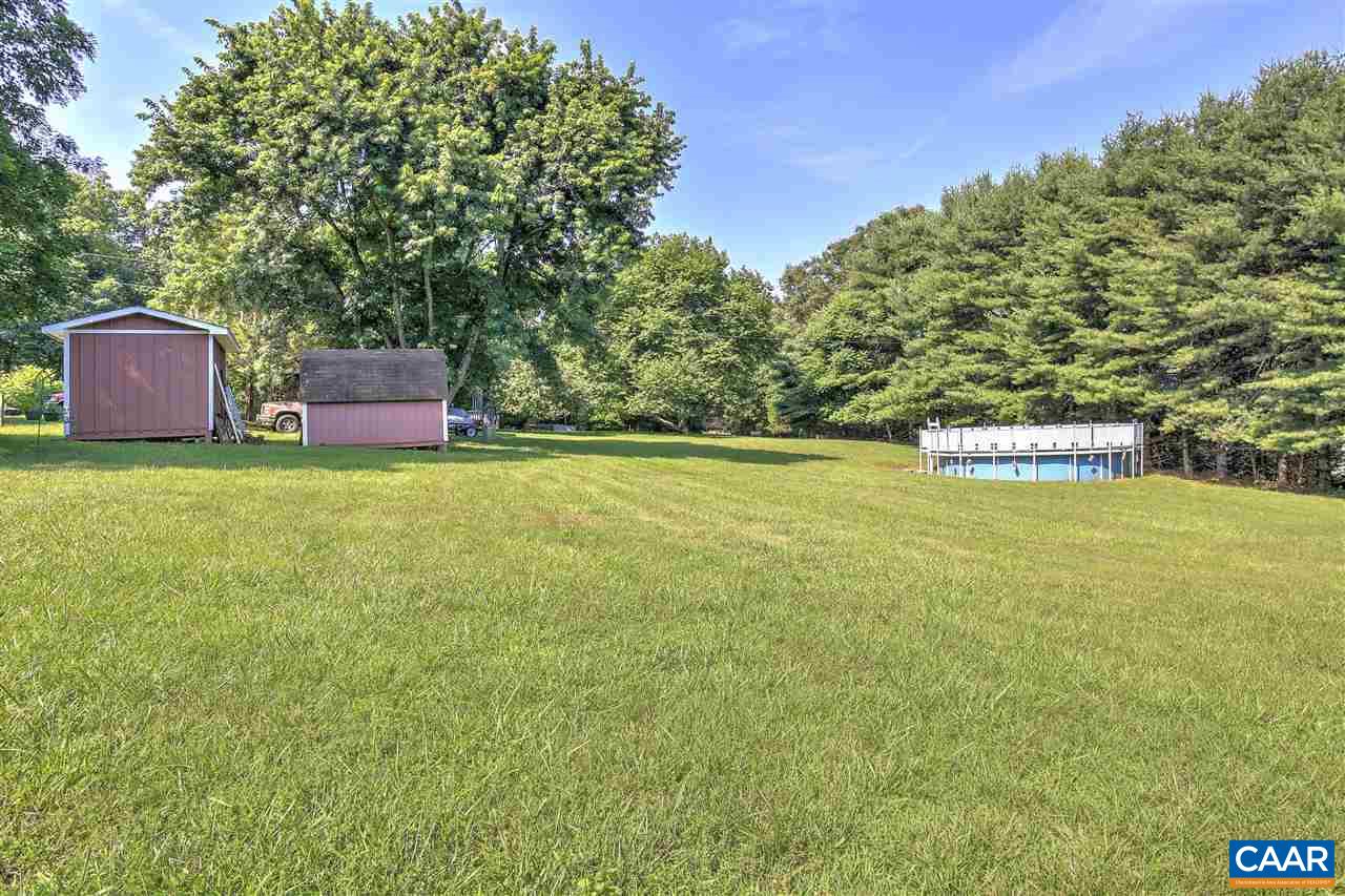 64 Horseshoe Hill Road Ruckersville, VA 22968 - Photo 26 of 33 a couple of table and chairs sitting in the middle of a field