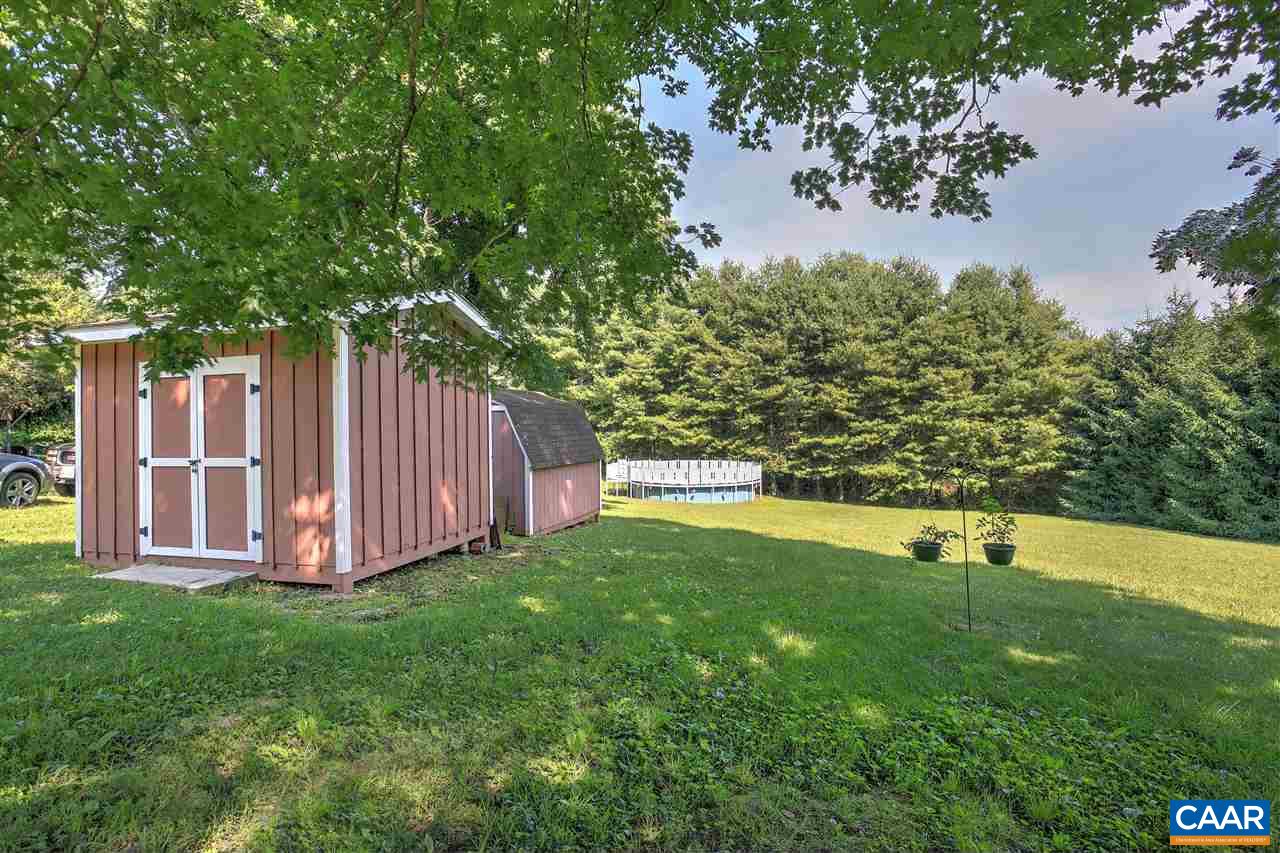 64 Horseshoe Hill Road Ruckersville, VA 22968 - Photo 30 of 33 a view of an house with backyard and trees