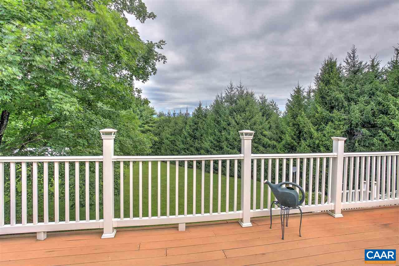 64 Horseshoe Hill Road Ruckersville, VA 22968 - Photo 4 of 33 a balcony with wooden floor and fence