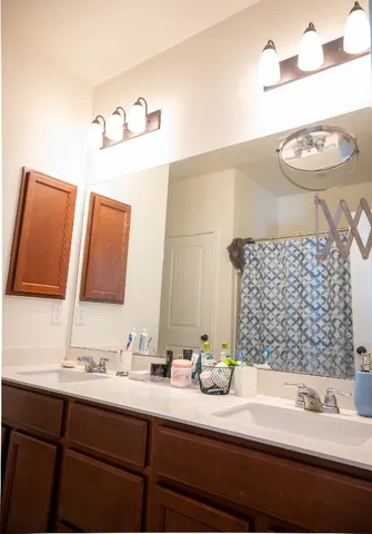 a view of an empty room with a bathroom