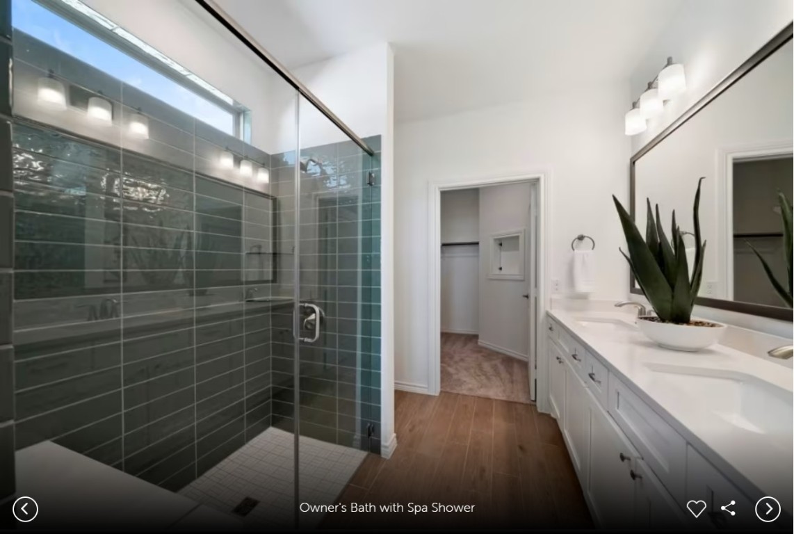 126 Kimberwick Court Georgetown, TX 78633 - Photo 8 of 10 a bathroom with a double vanity sink a large mirror and shower