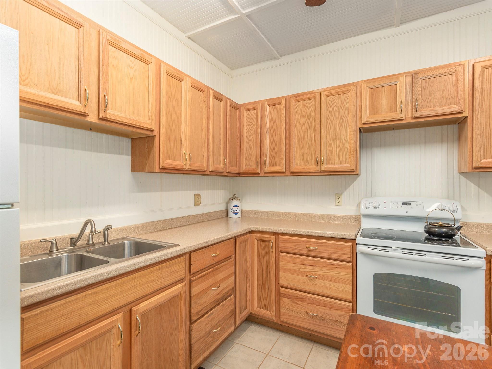 1120 Jacobs Branch Road Franklin, NC 28734 - Photo 20 of 36 a kitchen with a sink stove and cabinets