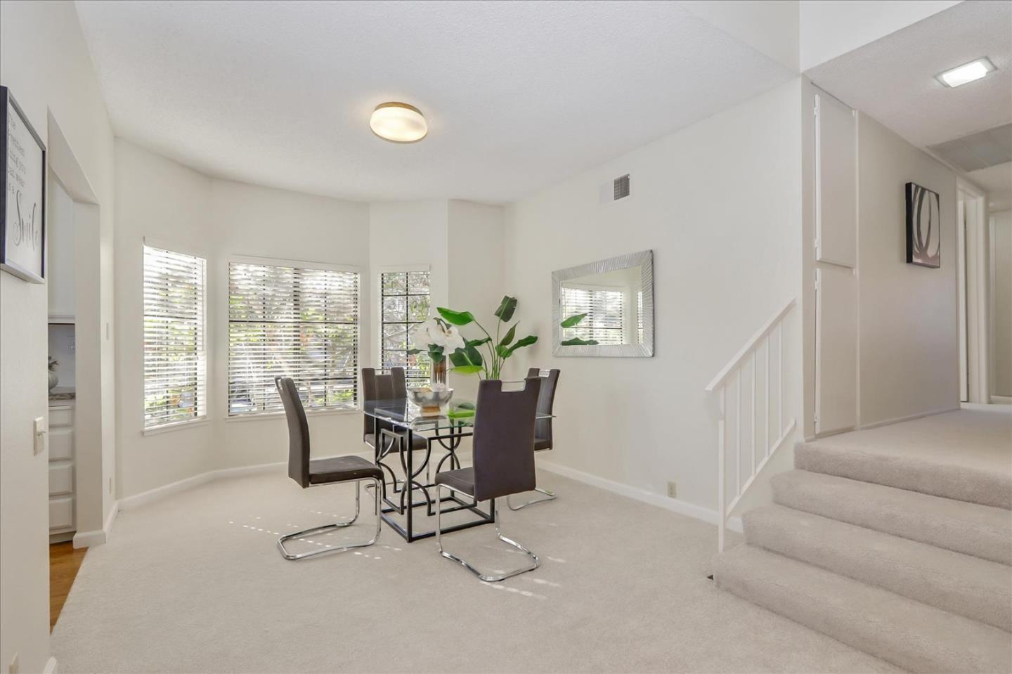 430 Costa Mesa Terrace, Unit E Sunnyvale, CA 94085 - Photo 11 of 40 a view of a livingroom with furniture and a window