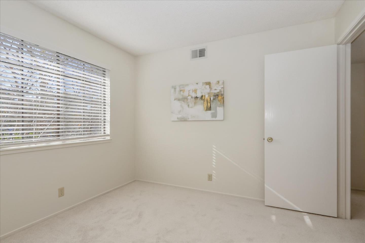 430 Costa Mesa Terrace, Unit E Sunnyvale, CA 94085 - Photo 17 of 40 an empty room with windows
