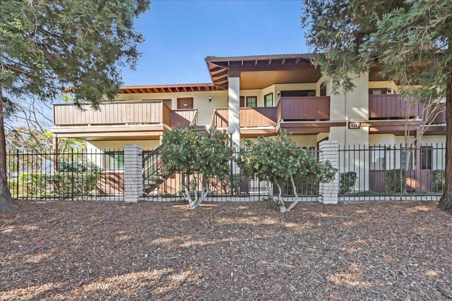 430 Costa Mesa Terrace, Unit E Sunnyvale, CA 94085 - Photo 2 of 40 front view of a house with a street