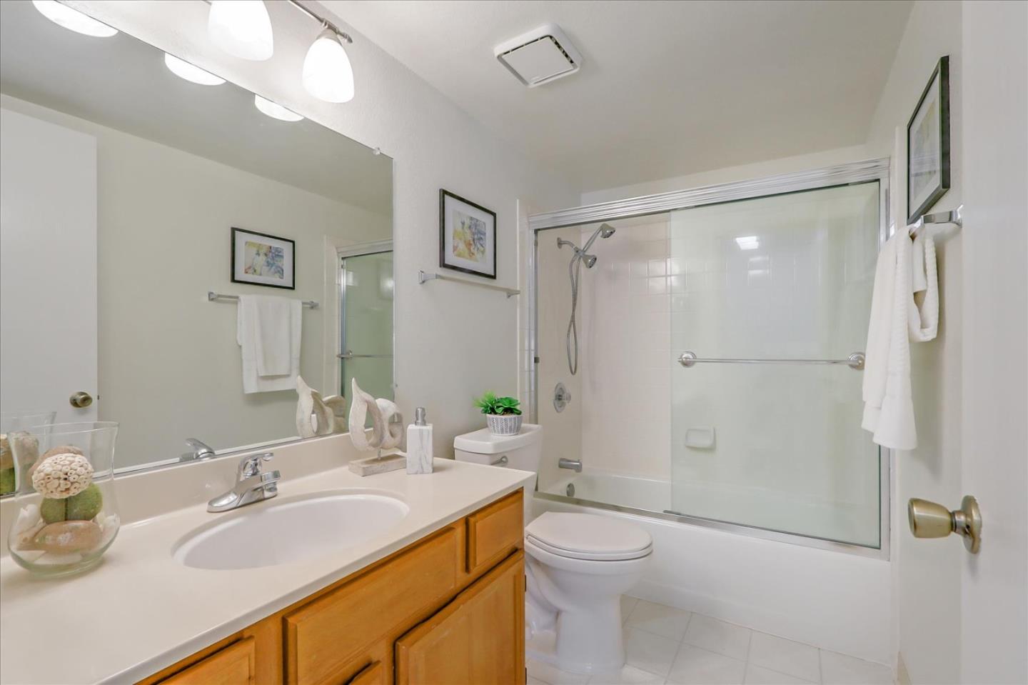 430 Costa Mesa Terrace, Unit E Sunnyvale, CA 94085 - Photo 21 of 40 a bathroom with a granite countertop sink toilet and shower
