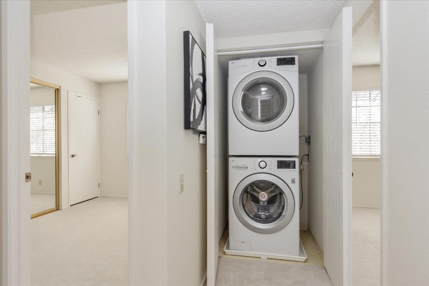 430 Costa Mesa Terrace, Unit E Sunnyvale, CA 94085 - Photo 22 of 40 a view of washer and dryer in a utility room