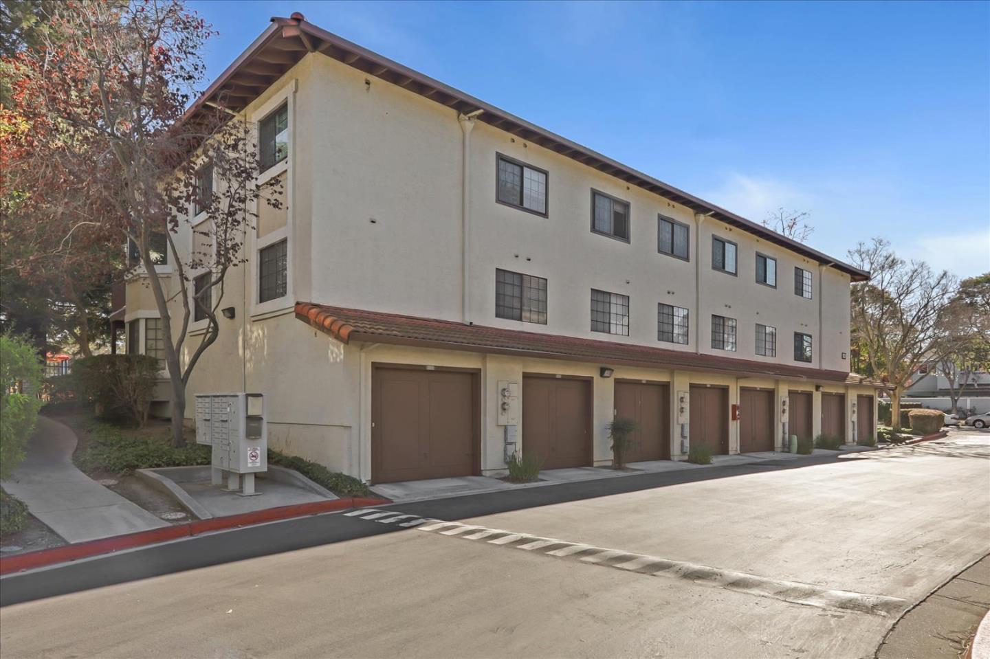 430 Costa Mesa Terrace, Unit E Sunnyvale, CA 94085 - Photo 27 of 40 a front view of a building with a road
