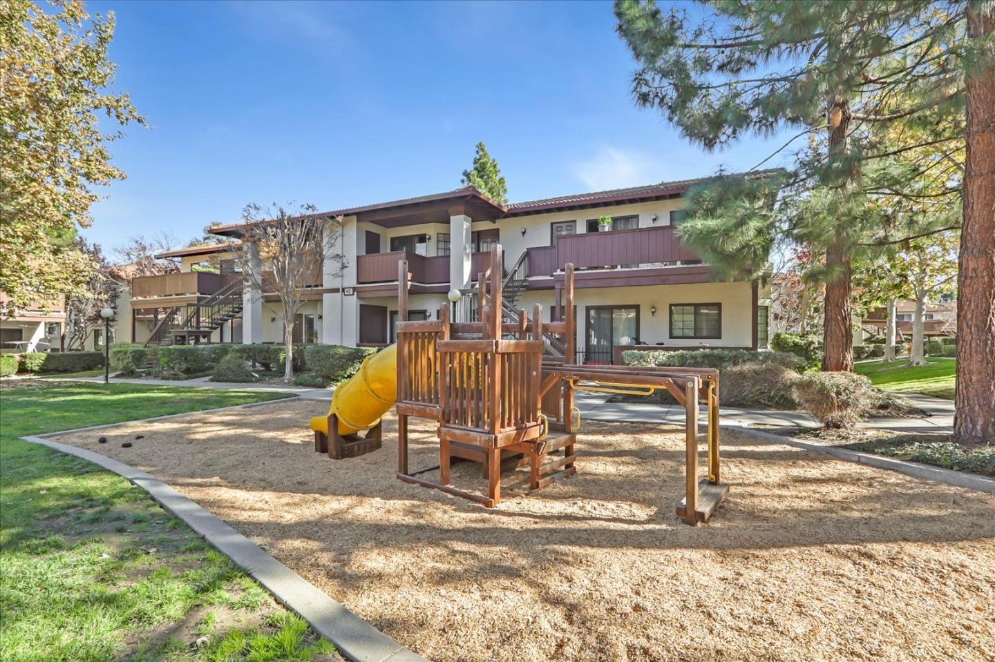 430 Costa Mesa Terrace, Unit E Sunnyvale, CA 94085 - Photo 29 of 40 a view of a house with a yard