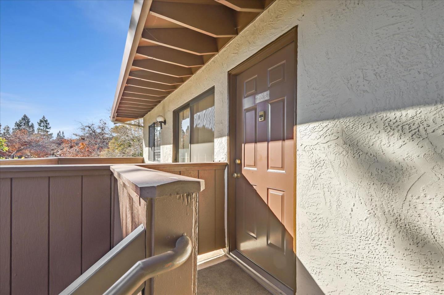 430 Costa Mesa Terrace, Unit E Sunnyvale, CA 94085 - Photo 3 of 40 a view of a balcony with furniture and wooden floor