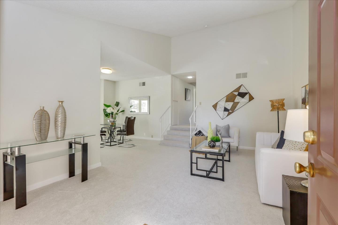 430 Costa Mesa Terrace, Unit E Sunnyvale, CA 94085 - Photo 4 of 40 a living room with furniture and a table
