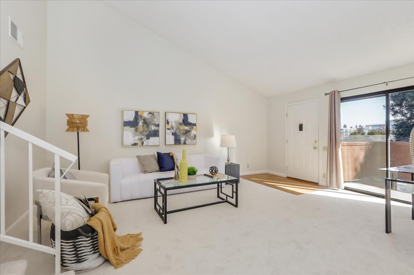 430 Costa Mesa Terrace, Unit E Sunnyvale, CA 94085 - Photo 6 of 40 a living room with furniture and a floor to ceiling window