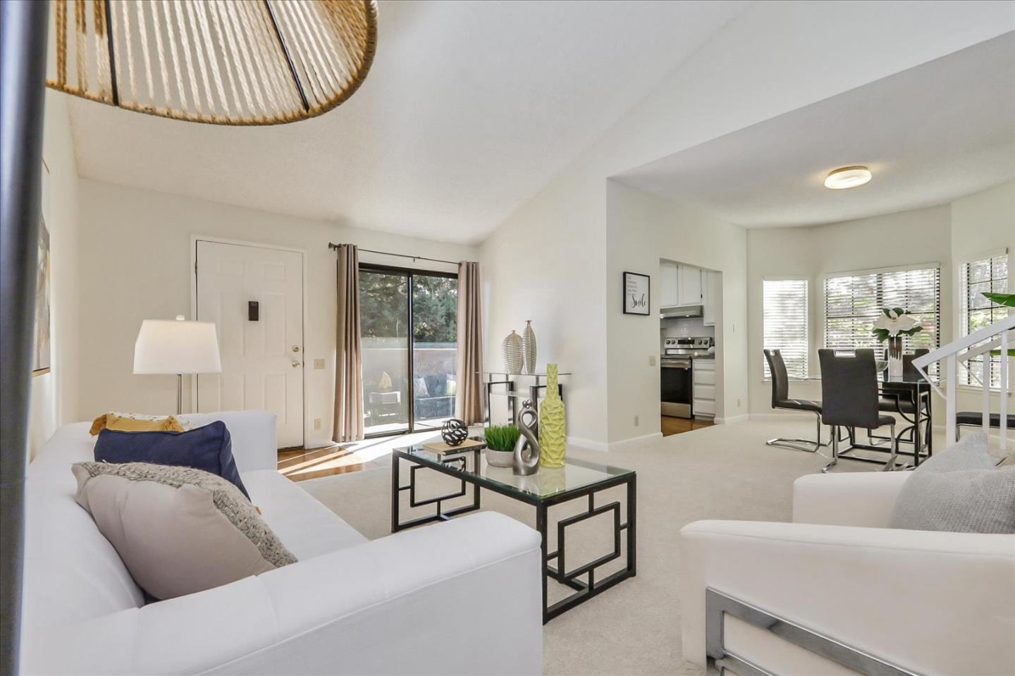 430 Costa Mesa Terrace, Unit E Sunnyvale, CA 94085 - Photo 8 of 40 a living room with furniture and a large window