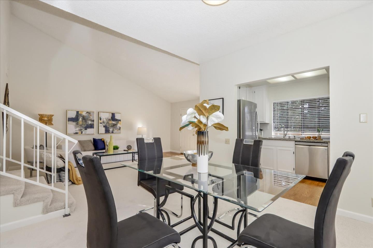 430 Costa Mesa Terrace, Unit E Sunnyvale, CA 94085 - Photo 10 of 40 a view of a dining room with furniture and wooden floor