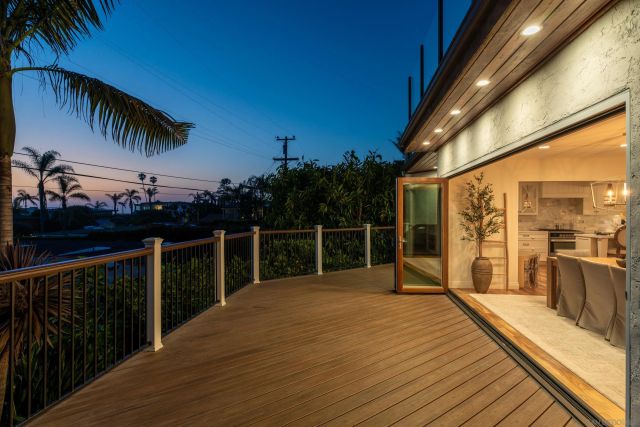 a view of a balcony with swimming pool and sitting area