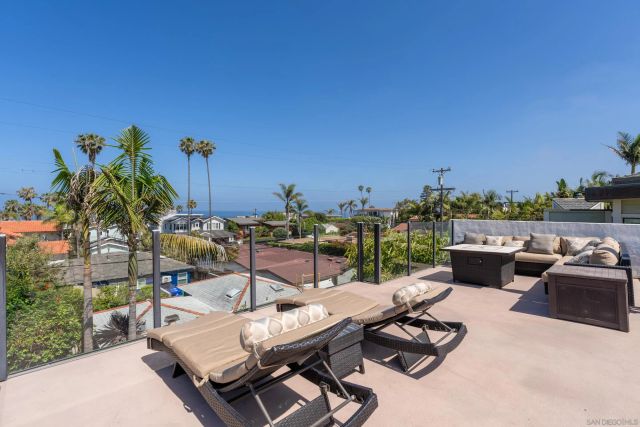 a view of a terrace with furniture and a table