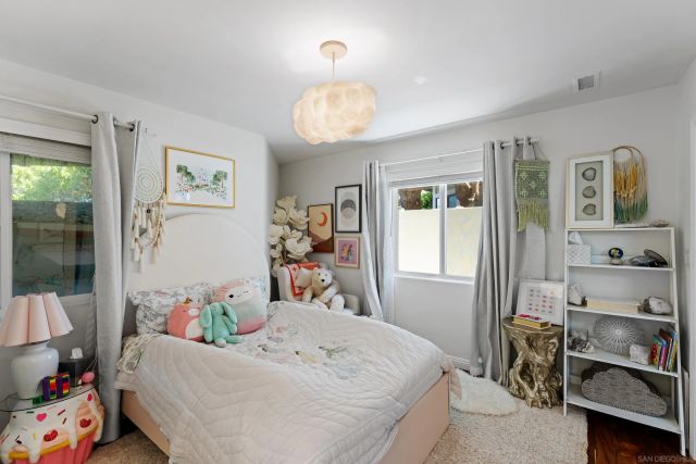 a bed room with a bed and a window