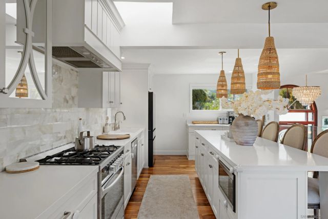 a kitchen with a sink stove and cabinets