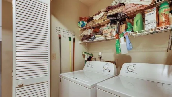 a utility room with dryer and washer