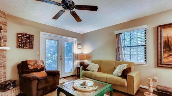 a living room with furniture and a window