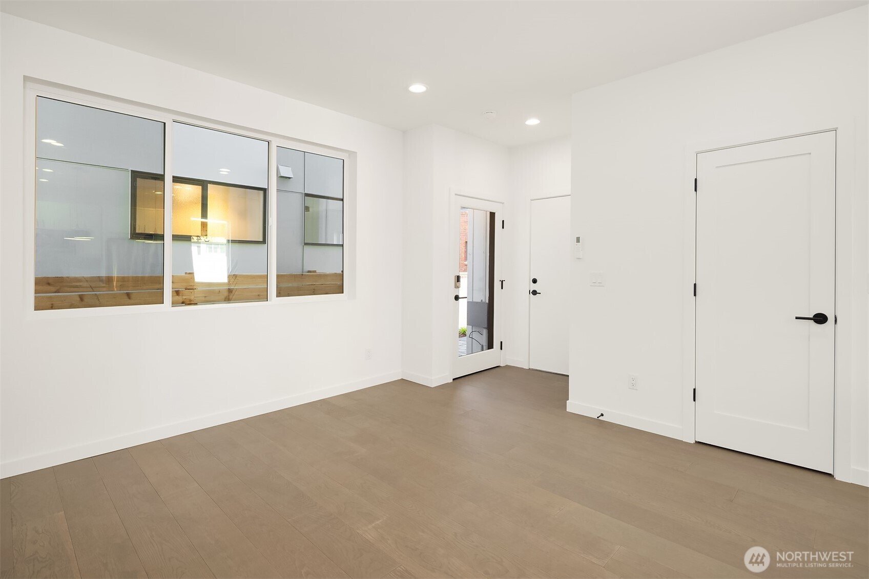 3444 Northwest 65th Street Seattle, WA 98117 - Photo 8 of 38 a view of an empty room with a window