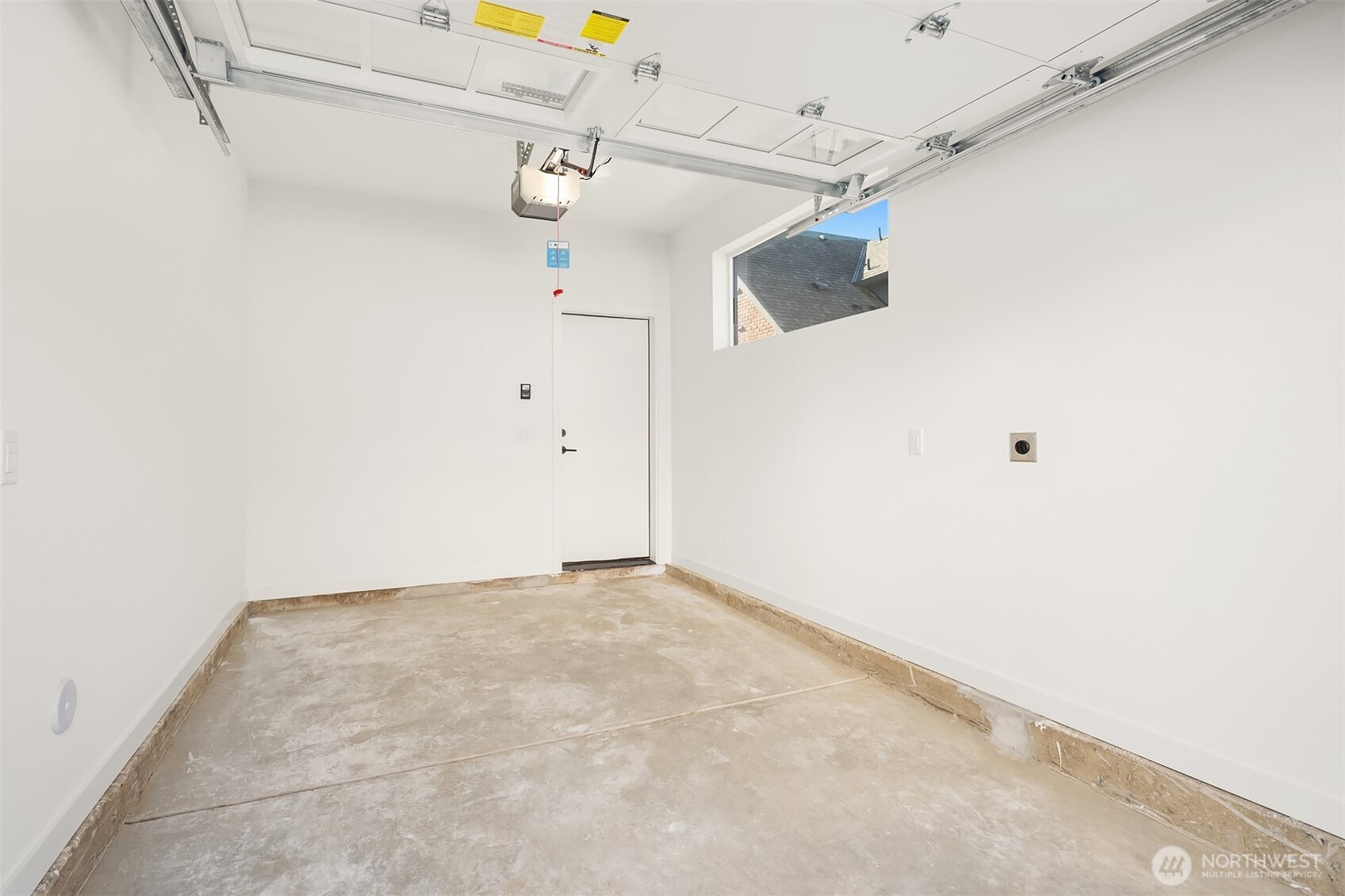 3444 Northwest 65th Street Seattle, WA 98117 - Photo 10 of 38 a view of a room with racks on the wall