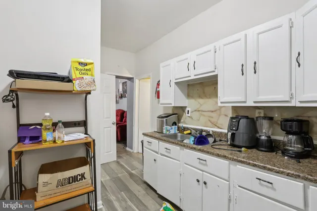 a kitchen with a sink and cabinets