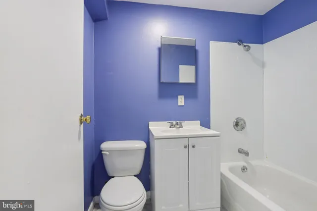 a bathroom with a toilet sink and bathtub