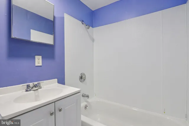 a bathroom with a sink and a bathtub