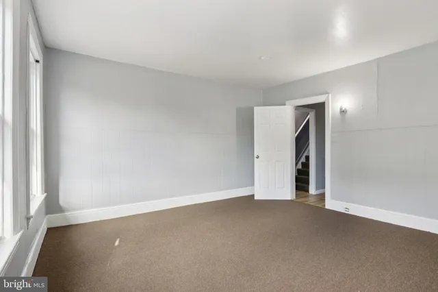 an empty room with a empty space and window