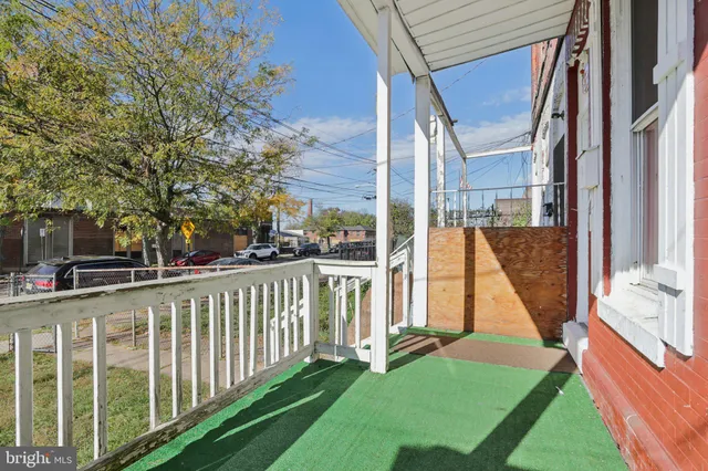 a view of a deck with a large trees