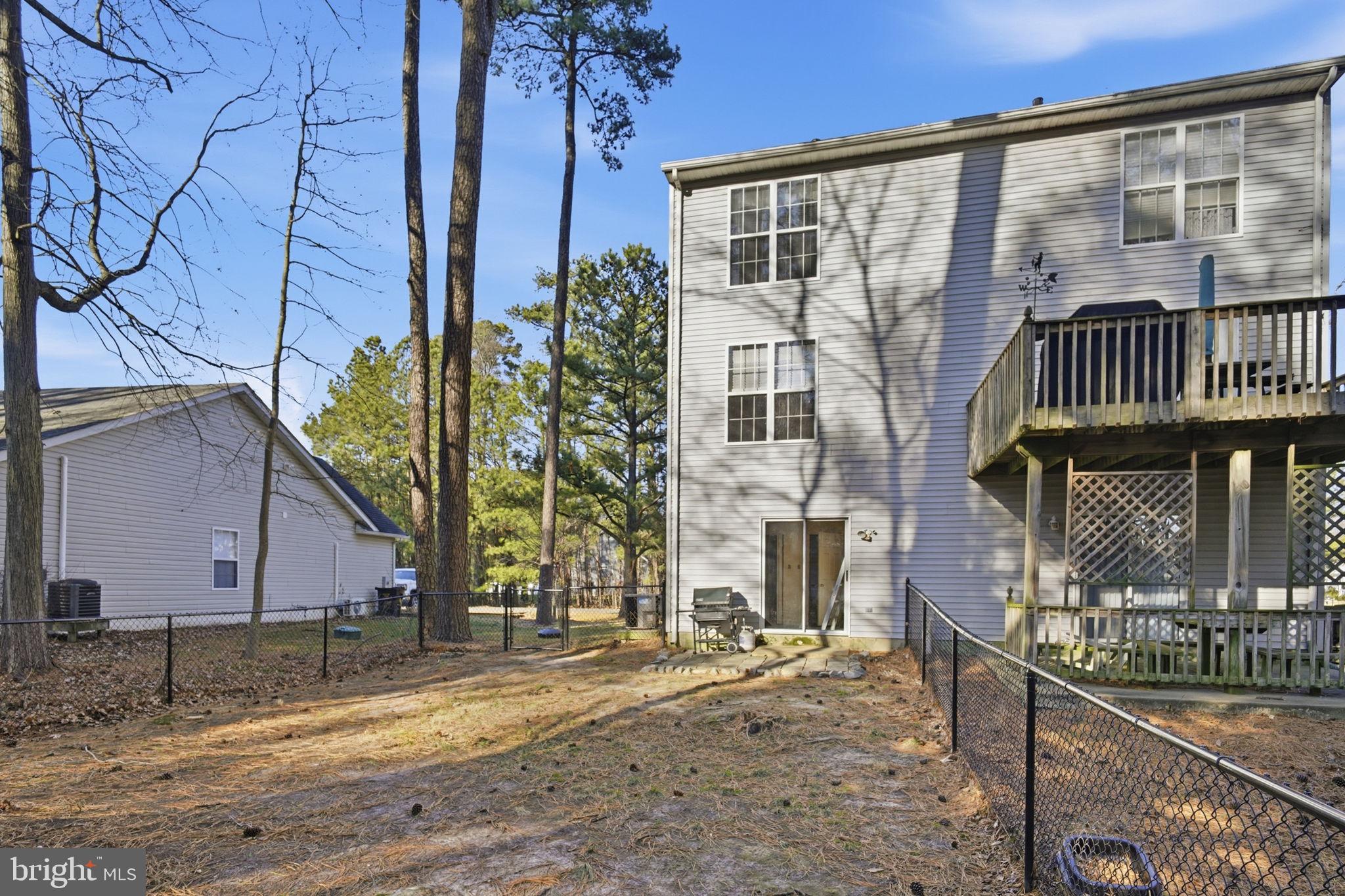 21103 Striper Run Rock Hall, MD 21661 - Photo 15 of 20 a front view of a house with garden