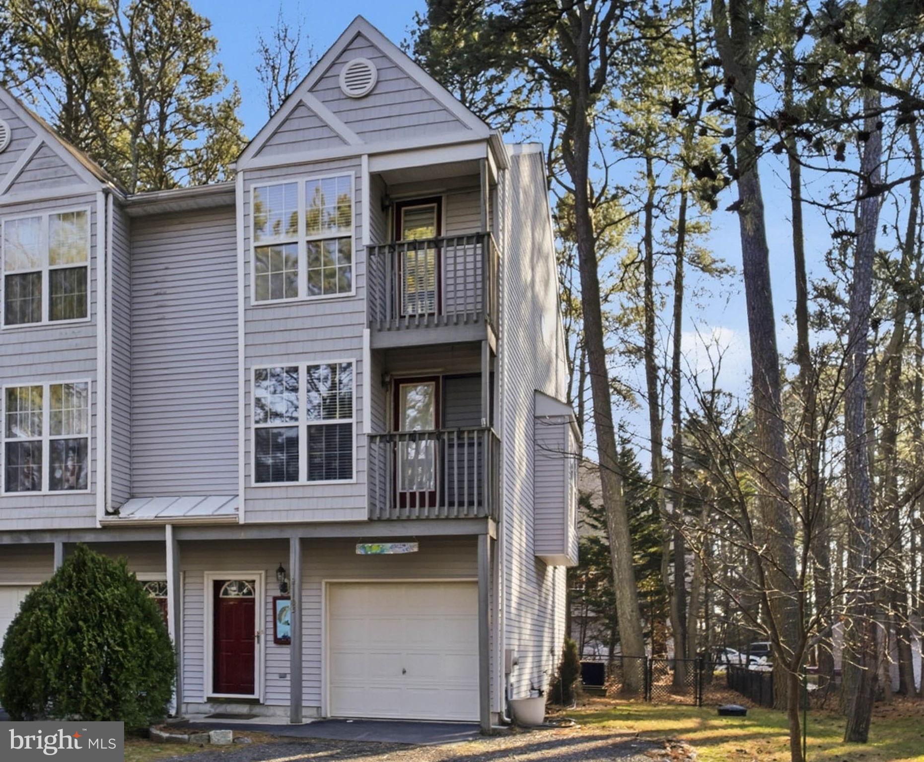 21103 Striper Run Rock Hall, MD 21661 - Photo 19 of 20 a front view of a house with a tree