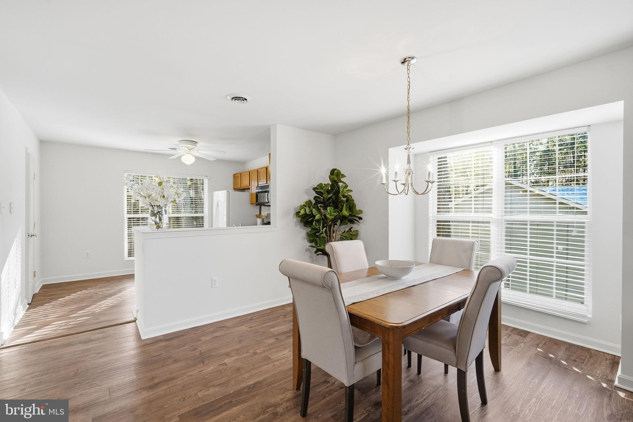 21103 Striper Run Rock Hall, MD 21661 - Photo 20 of 20 a dining room with furniture window and wooden floor