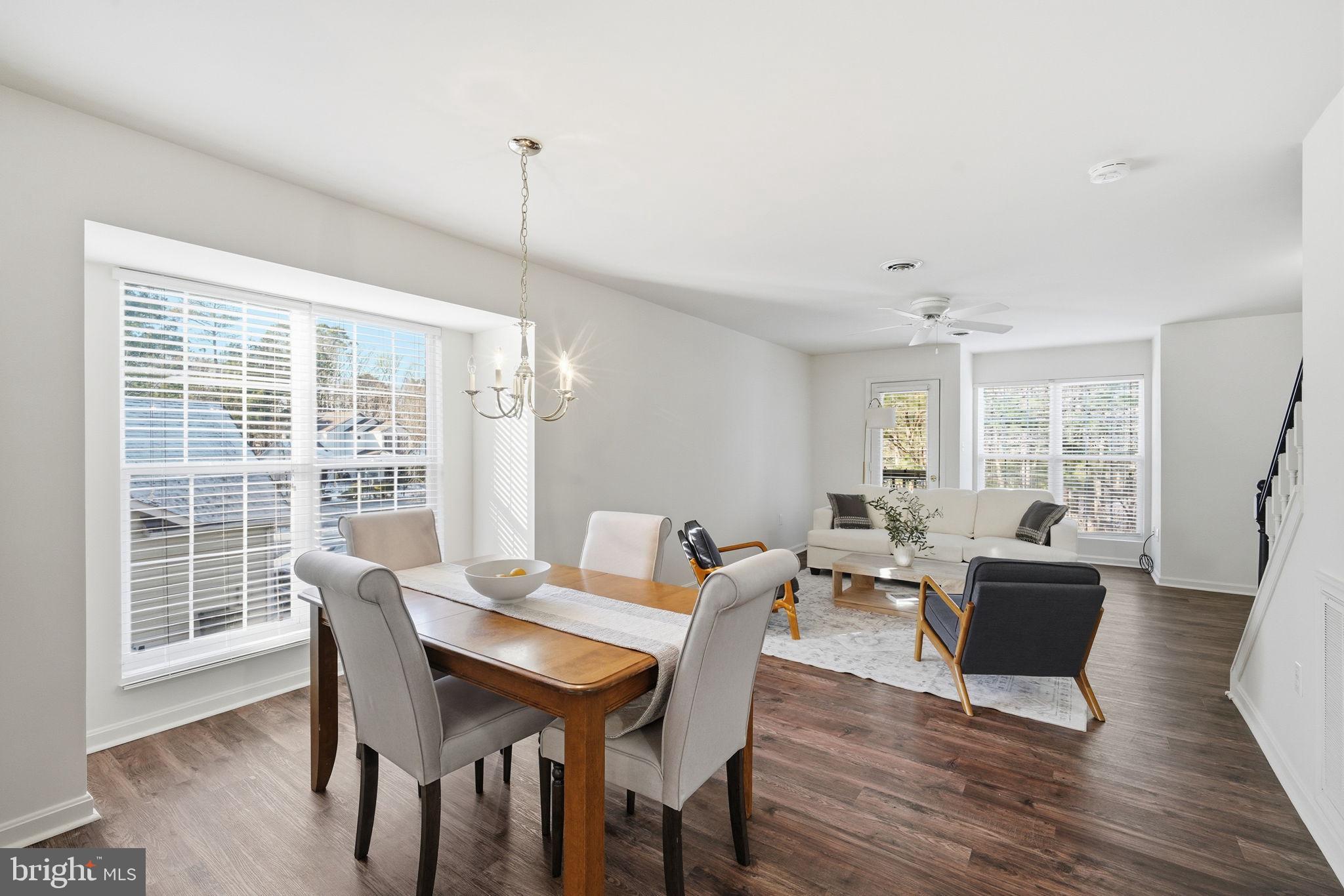 21103 Striper Run Rock Hall, MD 21661 - Photo 3 of 20 a view of a dining room with furniture window and wooden floor
