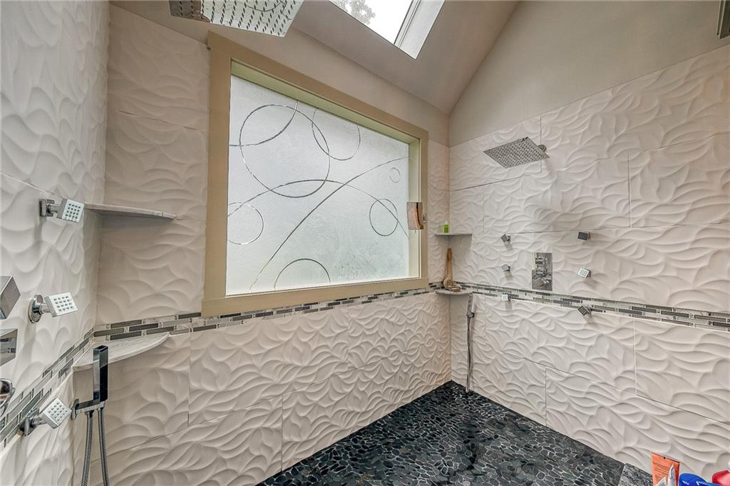 815 Mt Pleasant Road Mars, PA 16046 - Photo 23 of 42 Primary bathroom updated with custom maple cabinets, dual rain head shower system, heated floor. Enchanted glass custom inserts in primary bath windows.