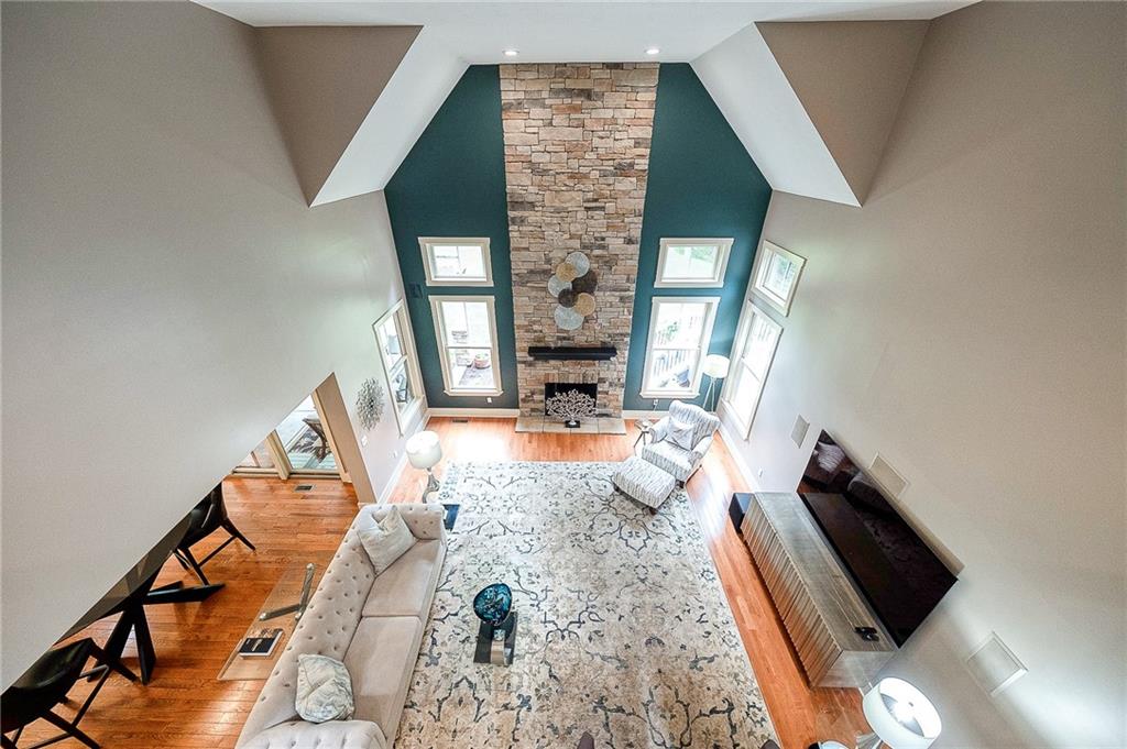 815 Mt Pleasant Road Mars, PA 16046 - Photo 10 of 42 Great Room - Stunning great room. The soaring ceiling and stone fireplace that truly steals the show!