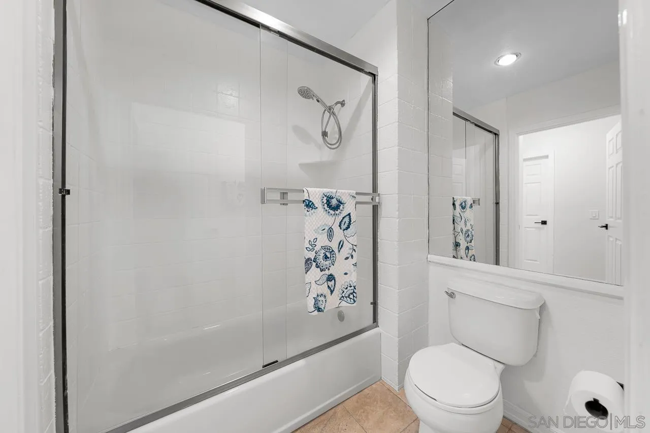 9860 Dale Avenue, Unit C3 Spring Valley, CA 91977 - Photo 15 of 26 a white toilet sitting next to a bathroom sink