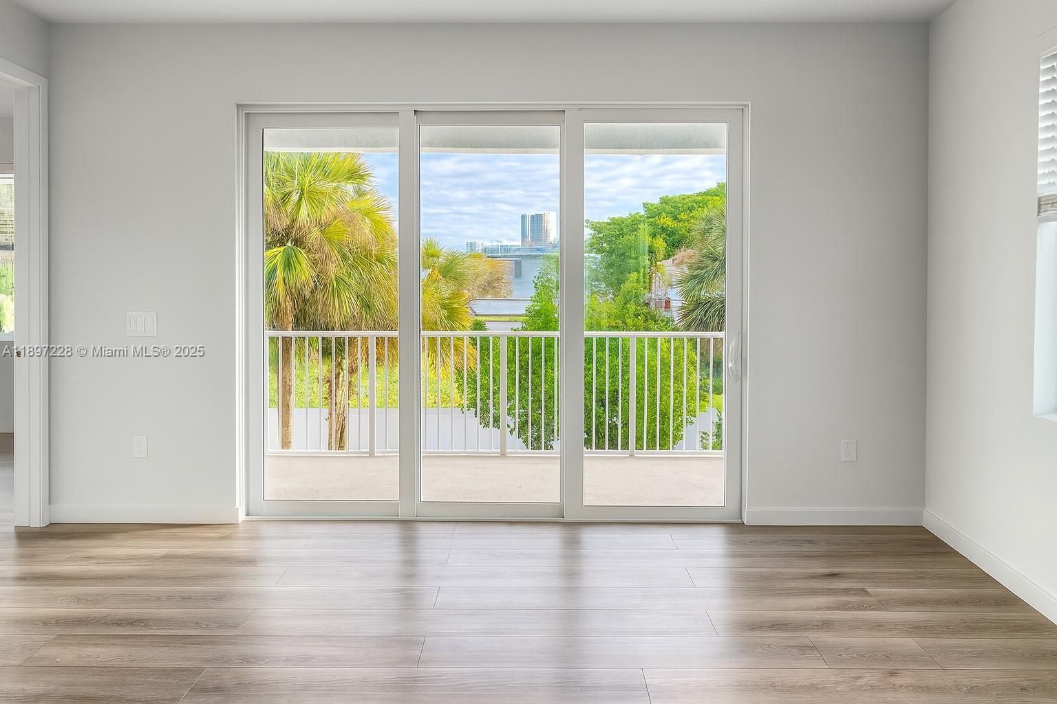 432 21st Street, Unit 432 West Palm Beach, FL 33407 - Photo 13 of 14 a view of a room with wooden floor and a window