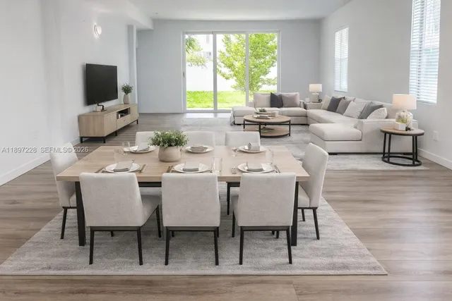a view of kitchen and hall with wooden floor