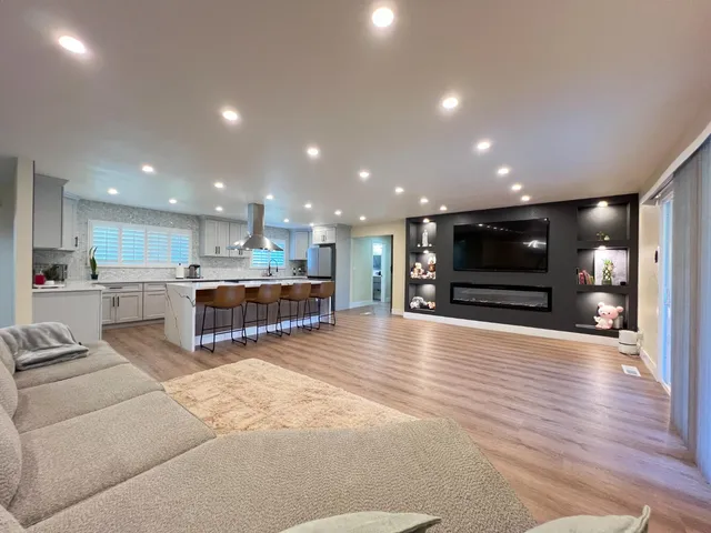 a view of kitchen with kitchen island microwave and stove
