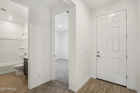 a view of an empty room with a window