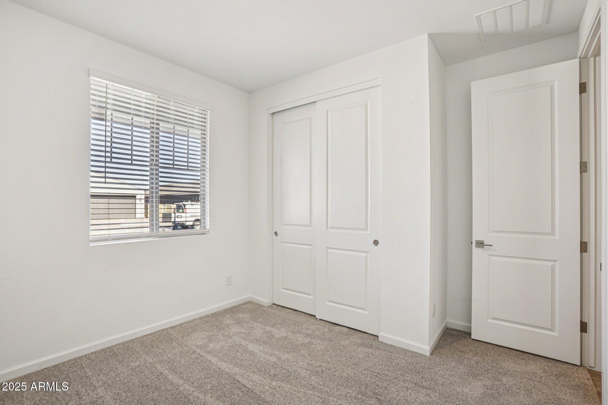 15723 West Brown Street Waddell, AZ 85355 - Photo 19 of 51 a view of an empty room with a window